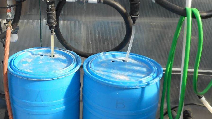 Two fertilizer injectors, each with a concentrated stock tank, connected in series to dispense a 2-part fertilizer.